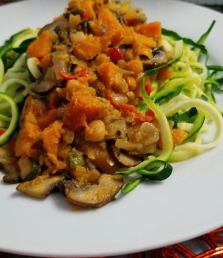 Zucchini pasta made with squash, mushrooms, sweet peppers, and spices — 100% gluten-free and alkaline meal.